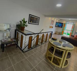 a living room with a table and a couch at Cozy Home In Magical Salento in Salento