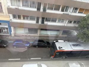 a view of cars parked in a parking lot in front of a building at Beenie 5 in Linz