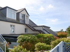 a house with stairs on the side of it at West Park in Hope-Cove +2 photos