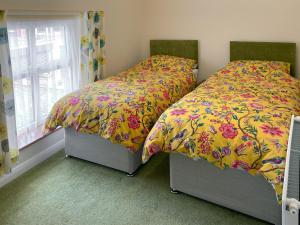 Voodi või voodid majutusasutuse Peartree Cottage toas +5 fotot