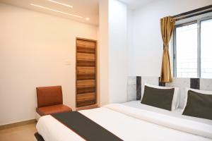 Ένα ή περισσότερα κρεβάτια σε δωμάτιο στο Super Collection O Heritage Near Acropolis Mall