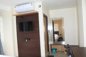 a room with a door with a air conditioner on top at Fern Inn Hotel in Kolkata