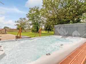 a jacuzzi tub sitting on top of a roof at Lode Hall in Upwell
