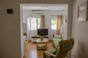 TV a/nebo společenská místnost v ubytování Apartamentos Casa Torres - Adults Only