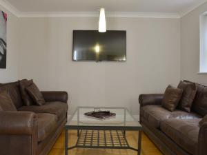 a living room with two couches and a glass table at Hollies Cottage 14 -Ukc4537 in Martock