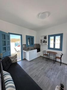 a living room with a couch and a table at #9 Lipsi Port Apartment - Gerani No#9 in Lipsoi