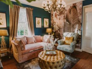 a living room with a couch and two chairs at Rose Blair Lodge - Uk31045 in Portpatrick