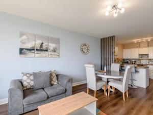 a living room with a couch and a table at Cottage 6 - Uk38217 in Ashby cum Fenby