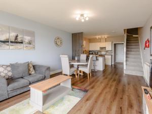 a living room with a couch and a table at Cottage 6 - Uk38217 in Ashby cum Fenby