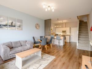 a living room with a couch and a table at Cottage 8 - Uk38219 in Ashby cum Fenby