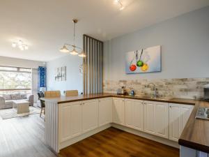 a kitchen with white cabinets and a counter top at Cottage 8 - Uk38219 in Ashby cum Fenby