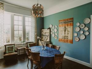 a dining room with a table and plates on the wall at Fern Forest House- Uk31047 in Portpatrick