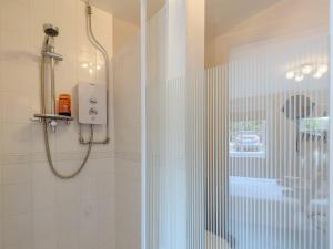 a shower with a glass door in a bathroom at Cottage 2 - Uk38222 in Ashby cum Fenby +6 photos