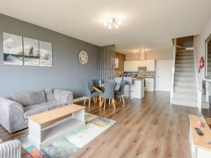 a living room with a couch and a table at Cottage 7 - Uk38218 in Ashby cum Fenby