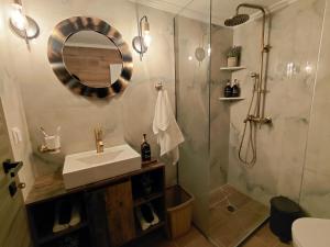 a bathroom with a sink and a shower at Simply Like Home in Kavala +49 photos