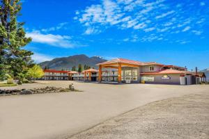 a large building with a mountain in the background at Days Inn by Wyndham Golden in Golden