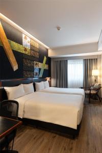 Voodi või voodid majutusasutuse Hilton Garden Inn Asuncion Aviadores Del Chaco toas