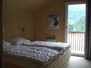 Katil atau katil-katil dalam bilik di Holiday home in Russbach with barbecue