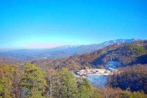 a view of a valley with a river and mountains at Big Bear Lodge Holiday home in Sevierville