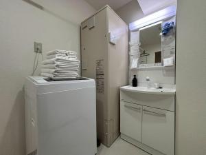 Un baño de Neighbor's Hotel 西広島駅前 37 fotos más