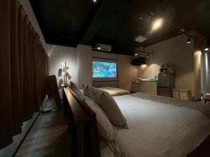 Una cama o camas en una habitación de Neighbor's Hotel 西広島駅前