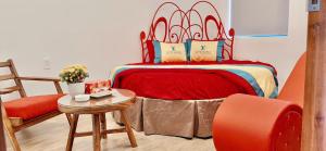 a bedroom with a bed and a table and a chair at Love Hotel Hóc Môn in Ho Chi Minh City +22 photos