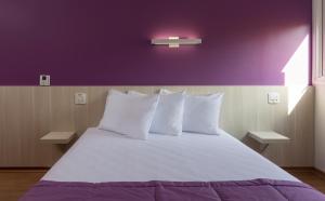 Giường trong phòng chung tại Go Inn Vitória