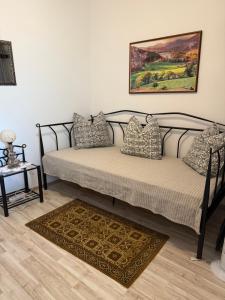 a bed with pillows on it in a room at House Mirjana in Selce