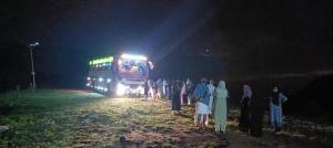 a group of people standing in front of a bus at Love shore homestay in Vagamon