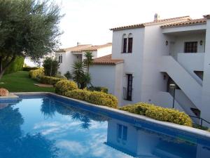 Bazén v ubytovaní CEL 103 Apartamento luminoso y sencillo en residencial ajardinado con piscina comunitaria - ES-228-22 alebo v jeho blízkosti