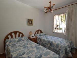 Posteľ alebo postele v izbe v ubytovaní Villa Xato en la Costa Dorada: Relájate en una Casa con Piscina Privada y Cerca de la Playa - ES-221-14