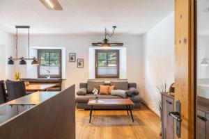 a living room with a couch and a table at Apart Celina in Oetz