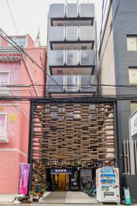 a building with a bunch of wood at 難波民泊301 in Osaka