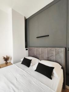 Ένα ή περισσότερα κρεβάτια σε δωμάτιο στο Antoni Apartment
