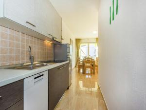 a kitchen with a sink and a counter top at Contemporary Holiday Home in Dramalj with Swimming Pool in Dramalj