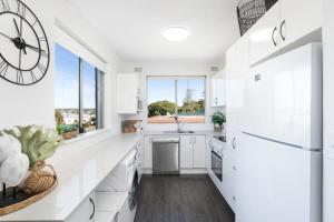 Kuchyň nebo kuchyňský kout v ubytování Chilling Bayside Waterfront