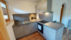 Kuchyňa alebo kuchynka v ubytovaní Zeitlos Apartments - Gerlos