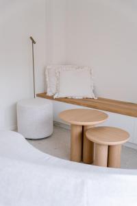 a room with two tables and a bench at La Brise Marine in Ostend +12 photos