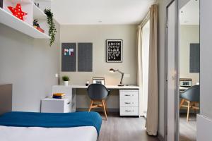 a bedroom with a desk and a bed and a chair at For Students Only - Saw Mill in Huddersfield in Huddersfield