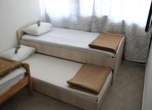 Postel nebo postele na pokoji v ubytování Apartman NeSa Boracko jezero