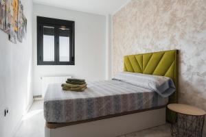 Ένα ή περισσότερα κρεβάτια σε δωμάτιο στο Home4u Granada Marymonte +65 φωτογραφίες