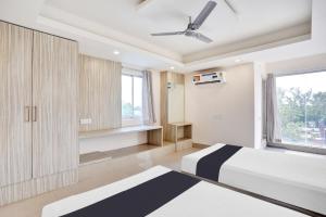Ένα ή περισσότερα κρεβάτια σε δωμάτιο στο Hotel O Vira