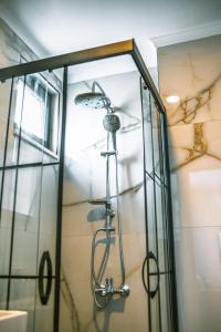 a shower in a bathroom with a glass enclosure at Jasmin 9 2+1 in Alanya