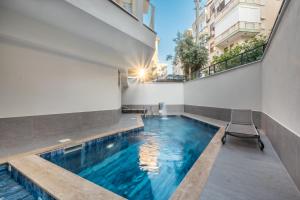 a swimming pool in the middle of a building at Jasmin 9 2+1 in Alanya