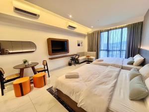 Postel nebo postele na pokoji v ubytování Naina Homestay at Sutera Bay