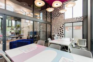 a conference room with tables and chairs and windows at Riverside House at Guildford in Guildford