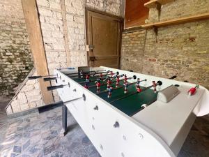 a table with a chess board on top of it at Le Repaire des 12- Hypercentre, jardin, idéal groupe, 5 chambres 5 salles de bain in Saint-Omer +33 photos
