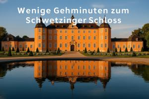 an orange building with its reflection in the water at Hotel Villa-Bassermann, stilvoll, 2 Min zum Schloss, schnelles WLAN & Parkplatz in Schwetzingen