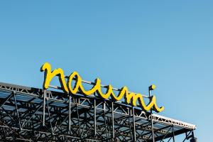 a sign on top of a metal structure at Naumi Auckland Airport Hotel in Auckland