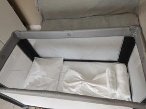 a shelf with three white towels in a room at Korina in Ofrínion